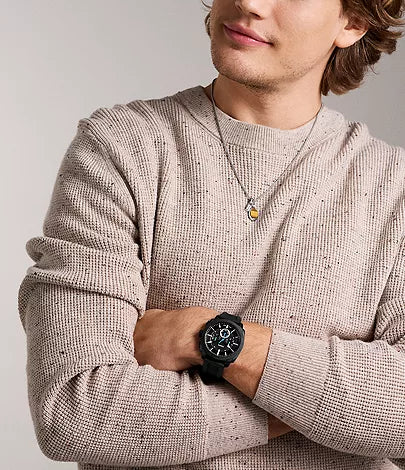 Fossil Machine chronograph watch worn on wrist, showing black case and dial on model