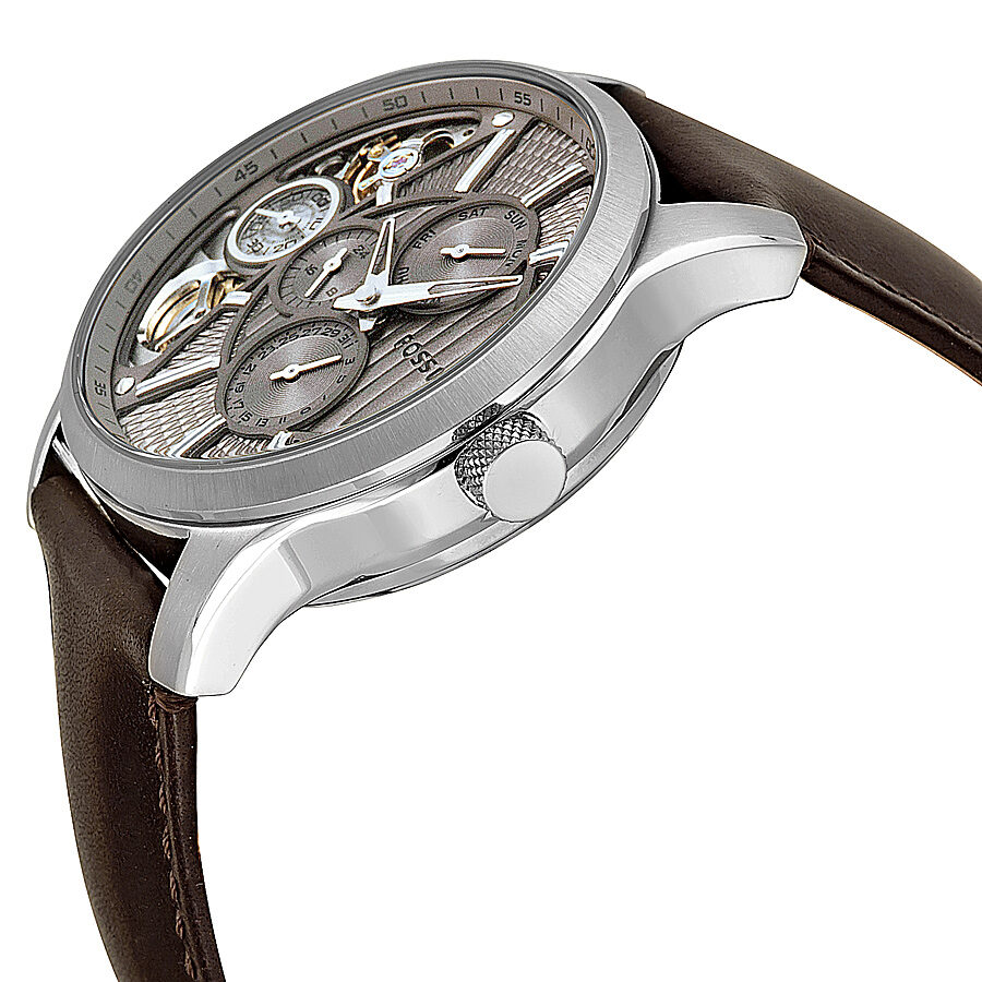 Side angle view of Fossil ME1098 showing taupe dial with visible movement and brown leather strap