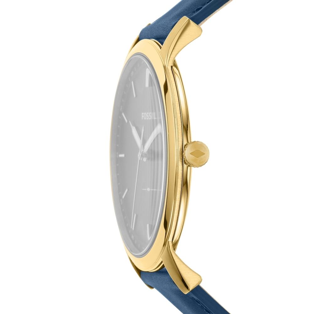 Fossil Minimalist watch side profile showing gold case and blue leather strap