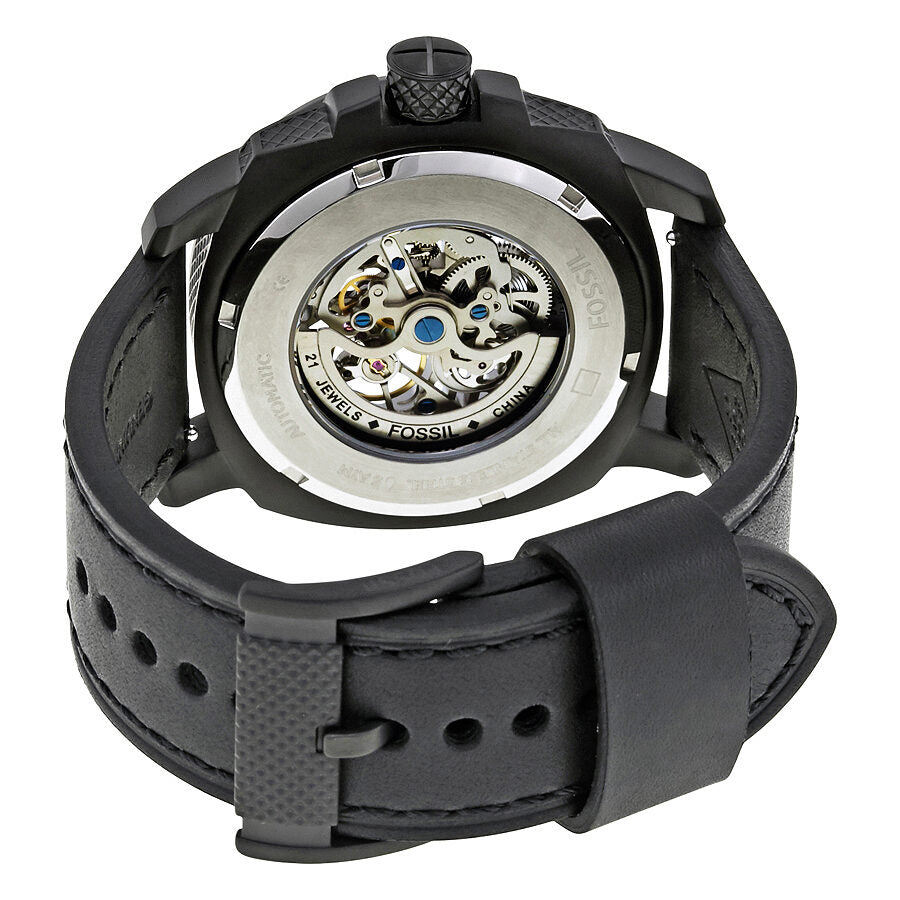Fossil Modern Machine caseback showing automatic movement with visible gear mechanism