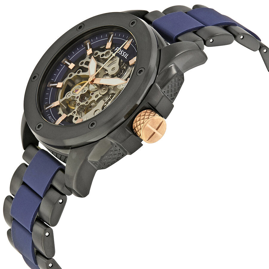 Fossil Modern Machine ME3133 watch at angle showing skeleton dial and rose gold crown
