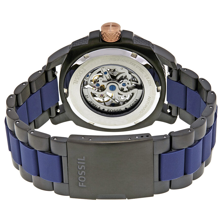 Fossil ME3133 caseback showing automatic movement and blue balance wheel