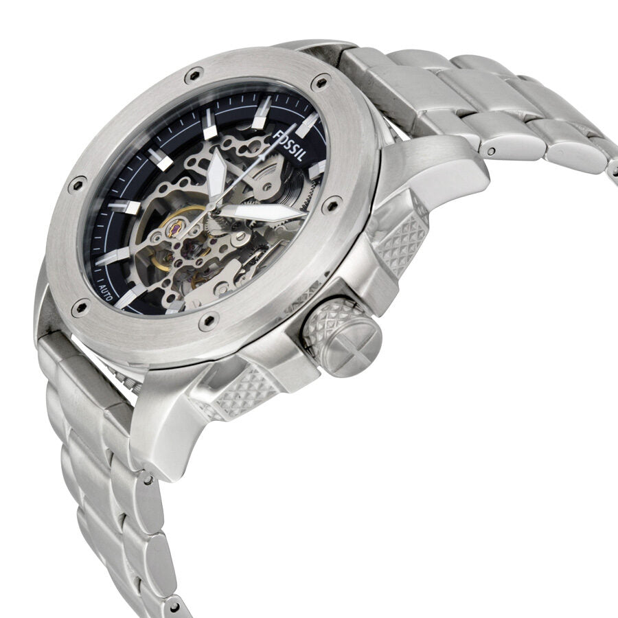 Fossil Modern Machine skeleton watch displayed at angle showing stainless steel case and bracelet