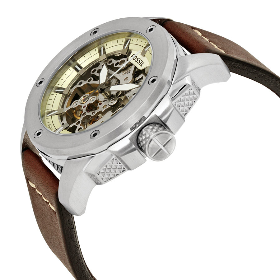 Side angle view showing silver case, brown leather strap, and exposed mechanical skeleton dial