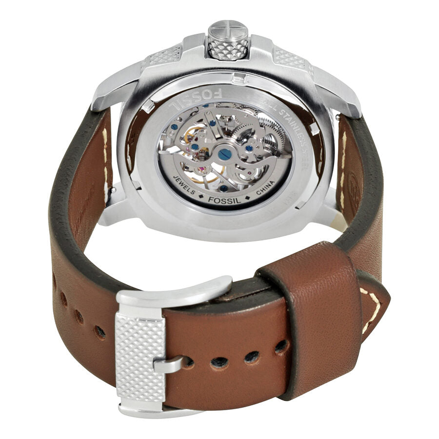 Case back view showing brown leather strap, white crown, and visible automatic movement through transparent back