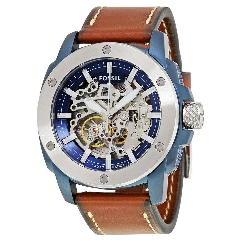 Fossil ME3135 skeleton dial watch showing blue case, brown leather strap, and exposed movement