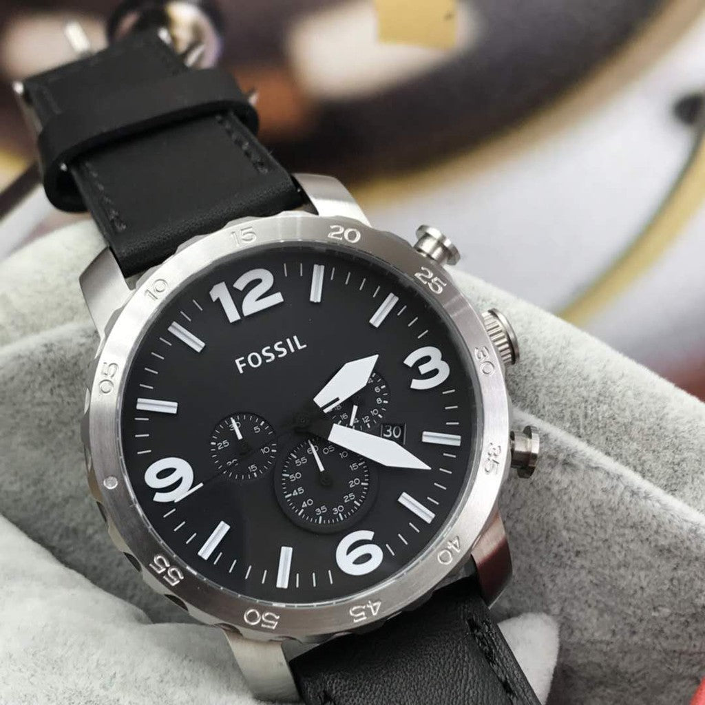 Fossil Nate chronograph watch worn on wrist showing black dial and silver-tone case