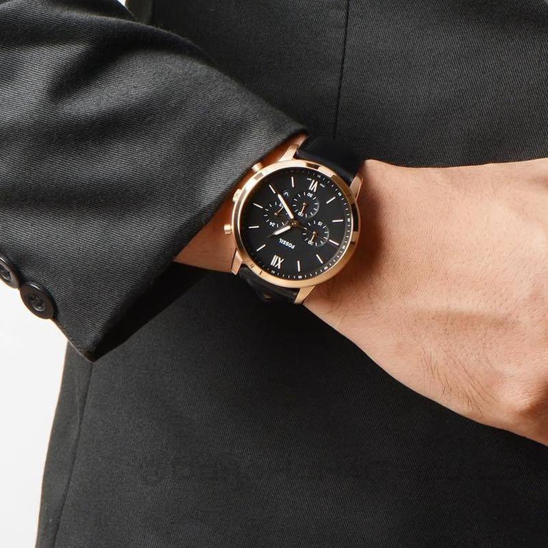 Fossil Neutra FS5381 worn on wrist with black dial and rose gold case