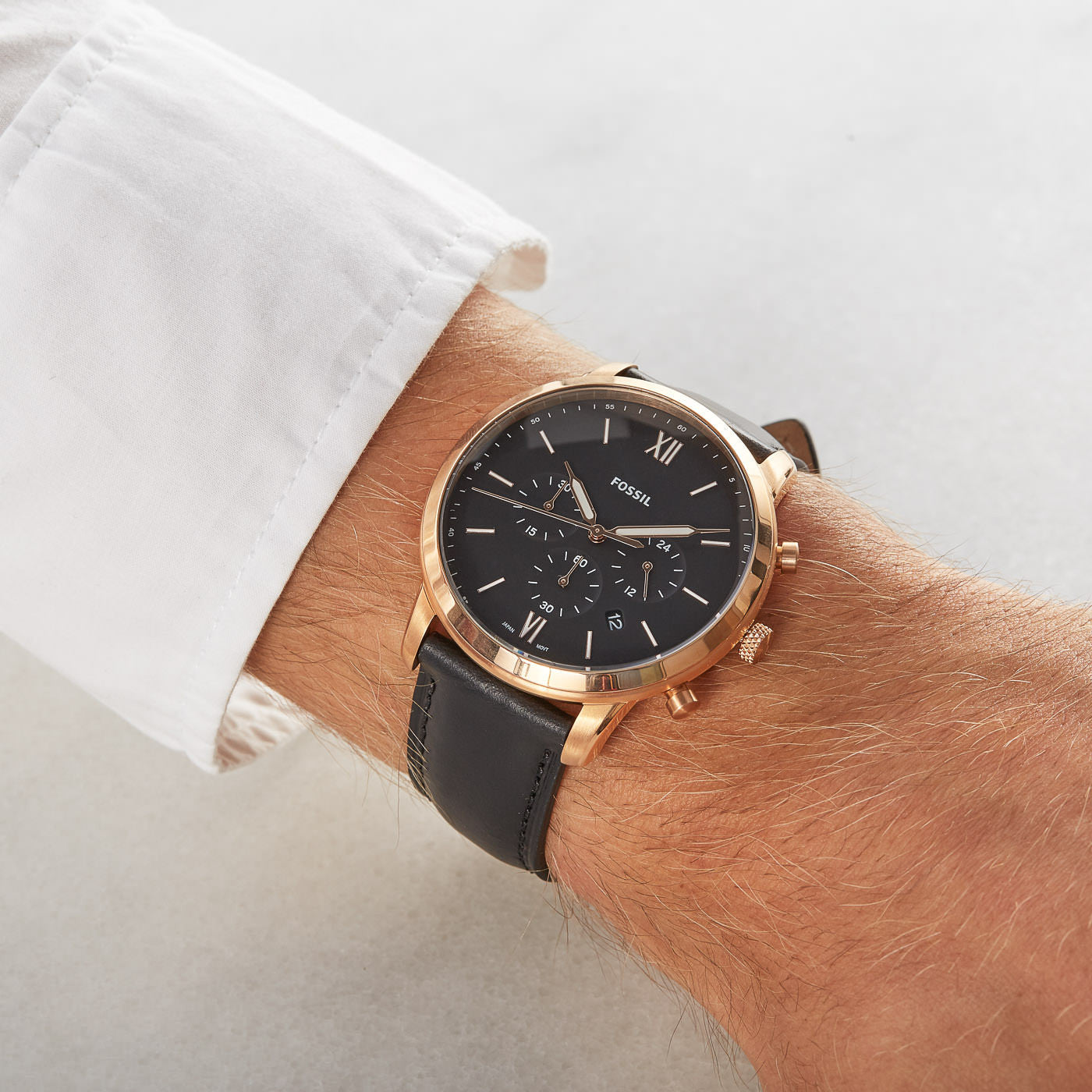 Fossil Neutra FS5381 chronograph watch worn on wrist with dress shirt