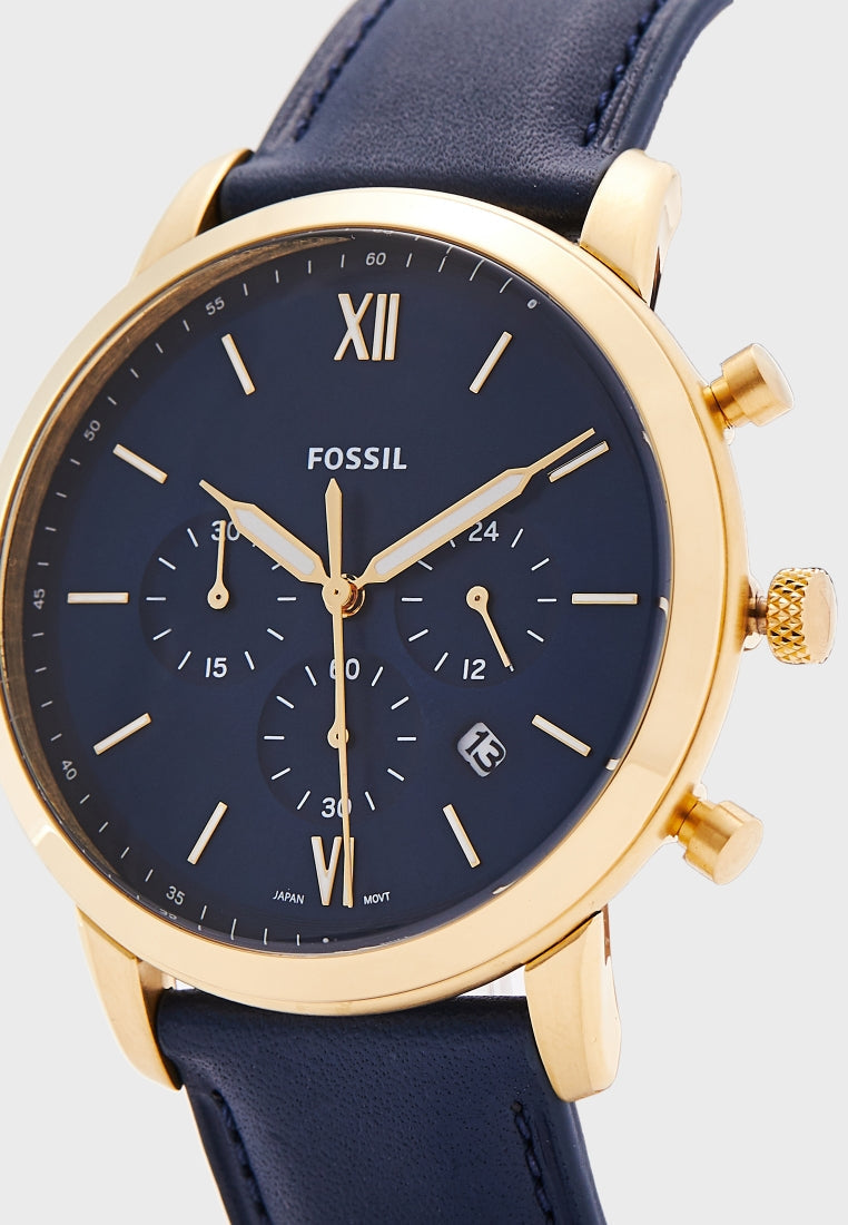 Angled view of Fossil Neutra Chronograph showing gold case, navy dial with Roman numerals, and chronograph subdials