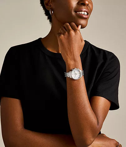 Fossil Neutra chronograph watch worn on wrist with white dial and crystal bezel