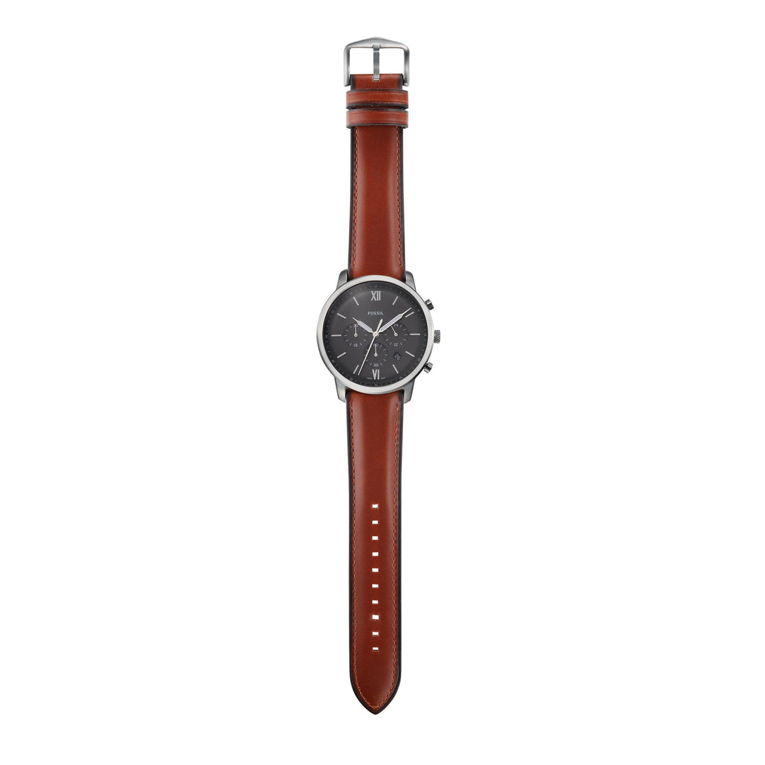Brown leather strap of Fossil Neutra watch with adjustable buckle and stitching details
