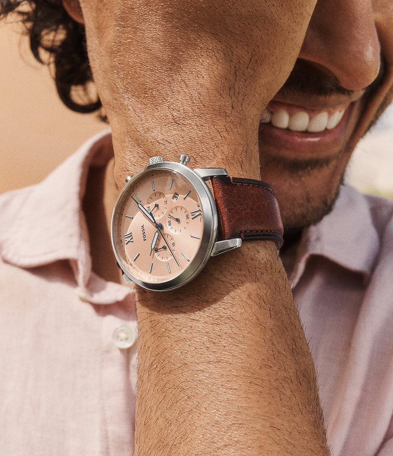 Fossil Neutra Chronograph watch worn on wrist with brown leather strap