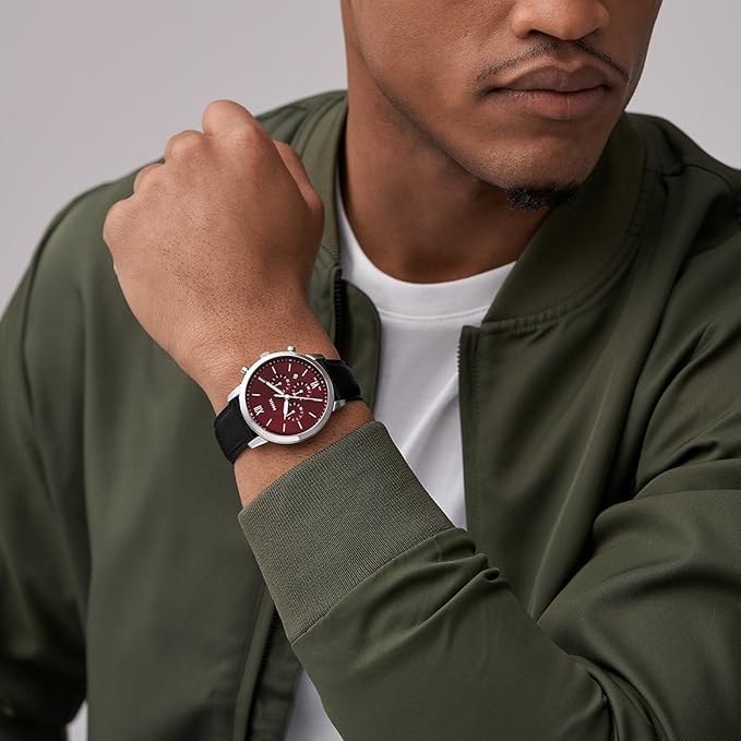 Fossil Neutra chronograph worn on wrist with burgundy dial and black leather strap