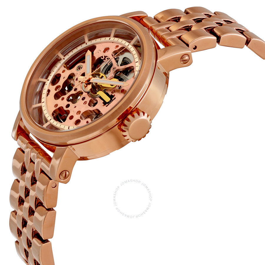 Fossil Original Boyfriend rose gold skeleton watch with visible automatic movement at angle