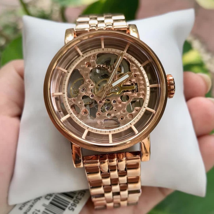 Fossil Original Boyfriend rose gold skeleton watch on wrist with visible automatic movement