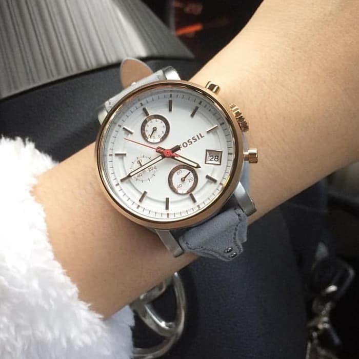 Fossil Boyfriend chronograph watch worn on wrist with white dial and grey leather strap