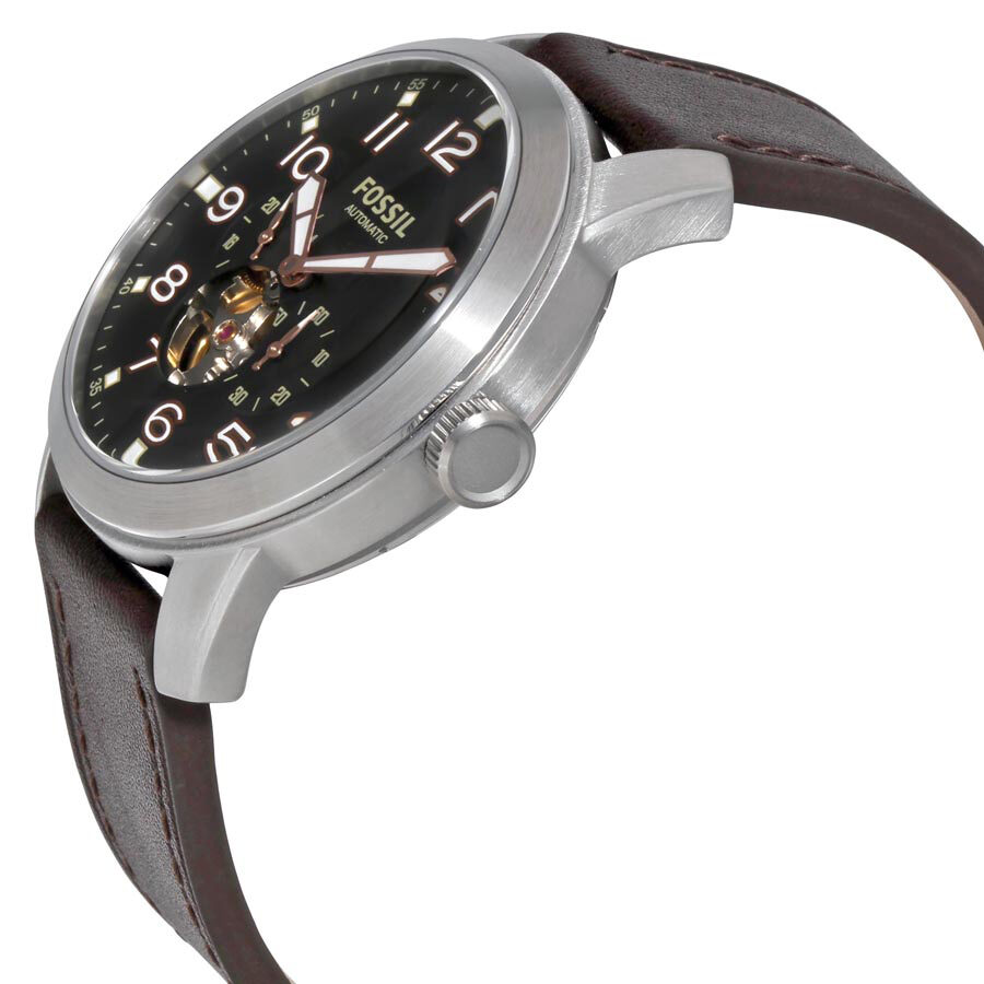 Fossil Pilot 54 watch at angle showing stainless steel case and visible movement window