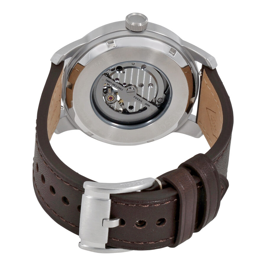 Fossil Pilot 54 caseback displaying automatic movement and brown leather strap attachment