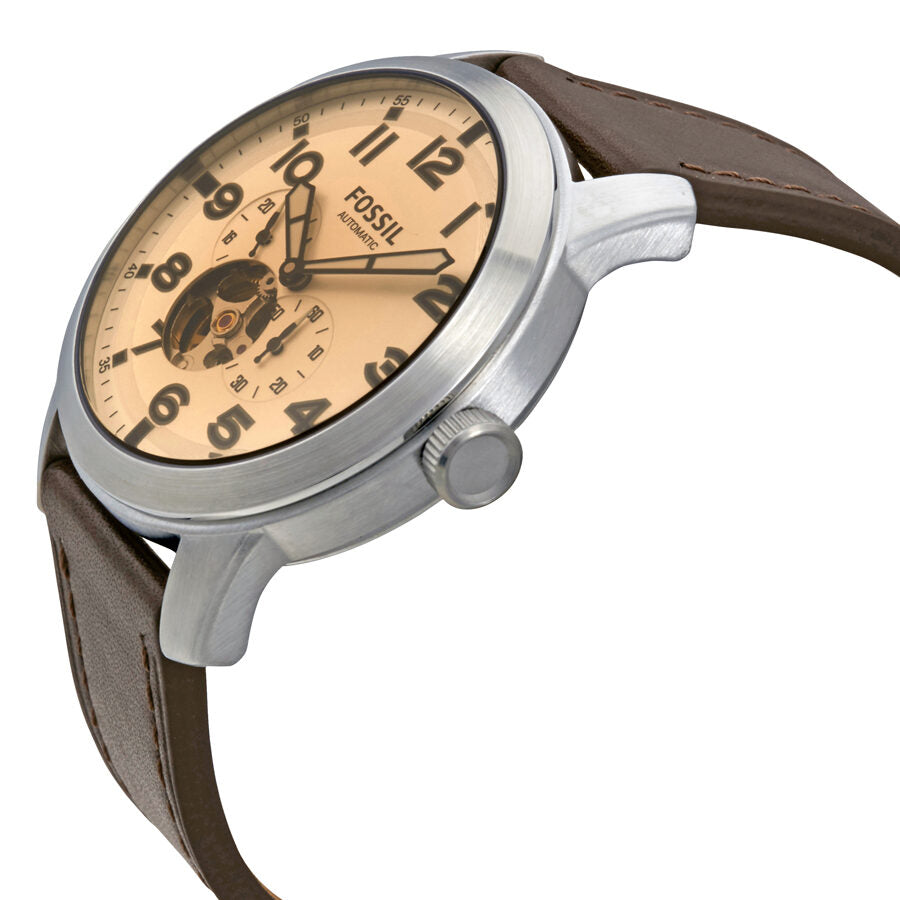 Side angle view of Fossil Pilot 54 watch with visible skeleton dial and brown leather strap