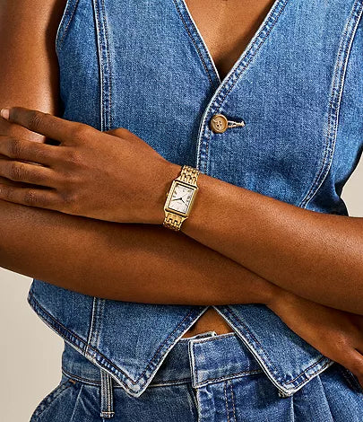 Fossil Raquel ES5220 watch worn on wrist with gold-tone bracelet and rectangular case