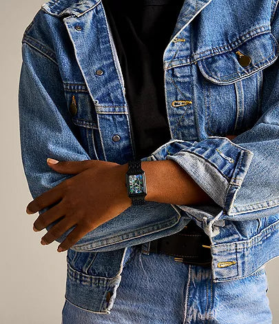 Fossil Raquel watch worn on wrist with black bracelet and multicolor dial