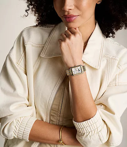 Fossil Raquel two-tone watch worn on wrist with white shirt