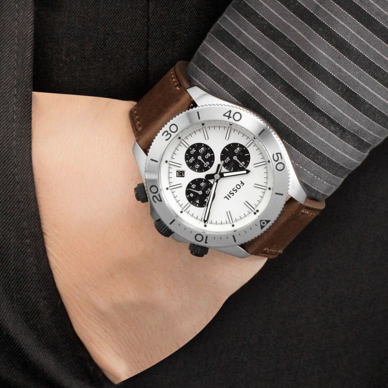 Fossil Retro Traveler Chronograph watch worn on wrist with brown leather strap