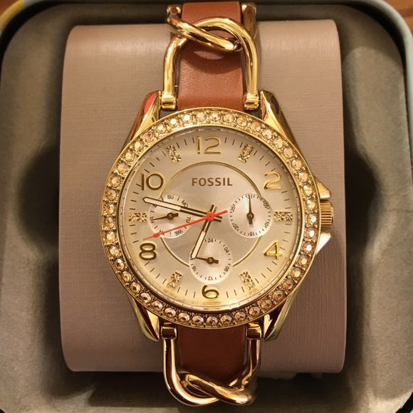 Fossil Riley watch displayed in retail presentation box with brown leather band