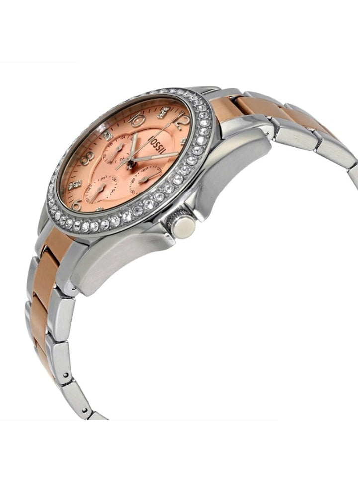 Side angle view of Fossil Riley watch with rose gold dial and mixed metal bracelet