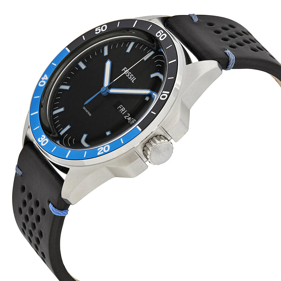 Fossil Sport 54 watch shown at angle displaying silver case, blue Batman bezel, and black perforated leather strap