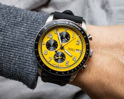 Fossil Sport Tourer Chronograph worn on wrist showing yellow dial and black silicone strap