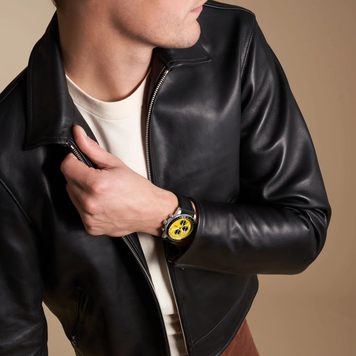 Fossil Sport Tourer Chronograph on wrist with yellow dial and black leather jacket