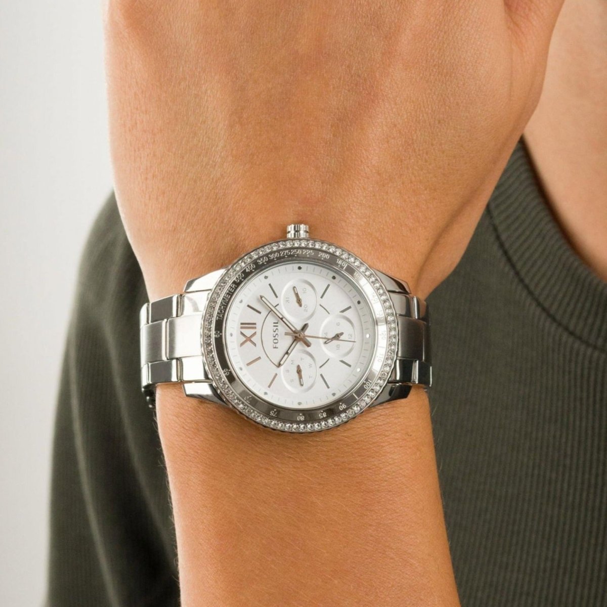 Fossil Stella Sport chronograph watch worn on wrist with silver dial and diamond bezel