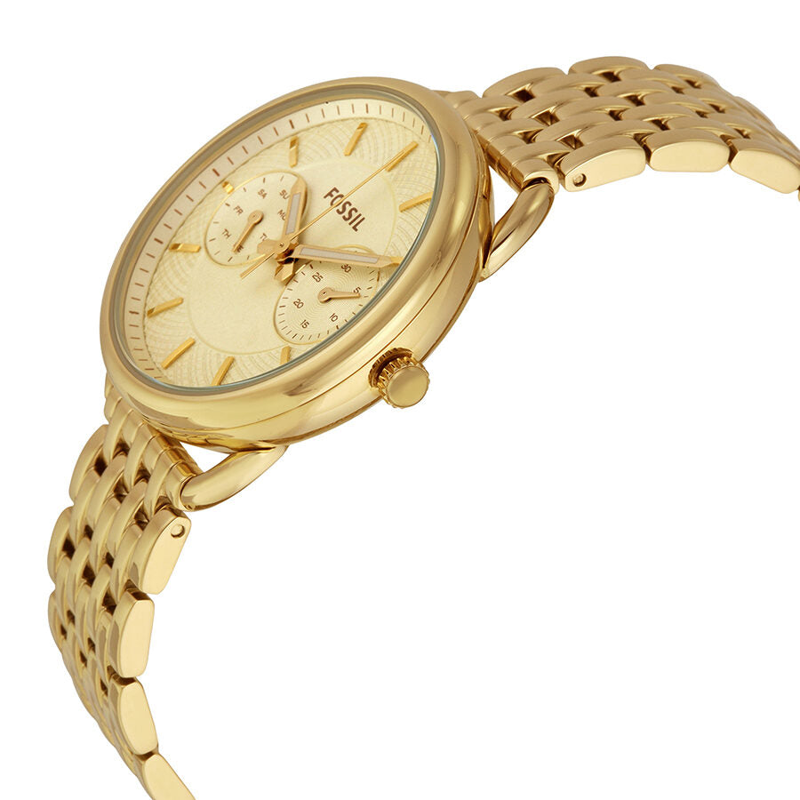 Fossil Tailor gold watch at angle showing dial detail and linked gold bracelet