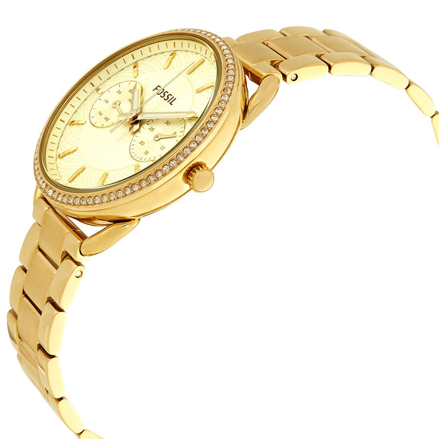 Fossil Tailor watch shown at angle displaying gold-tone case profile and white dial with chronograph subdials
