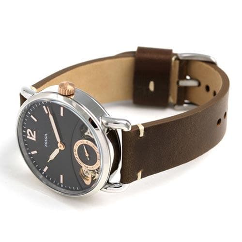 Angled view of Fossil The Commuter watch with black dial and brown leather strap