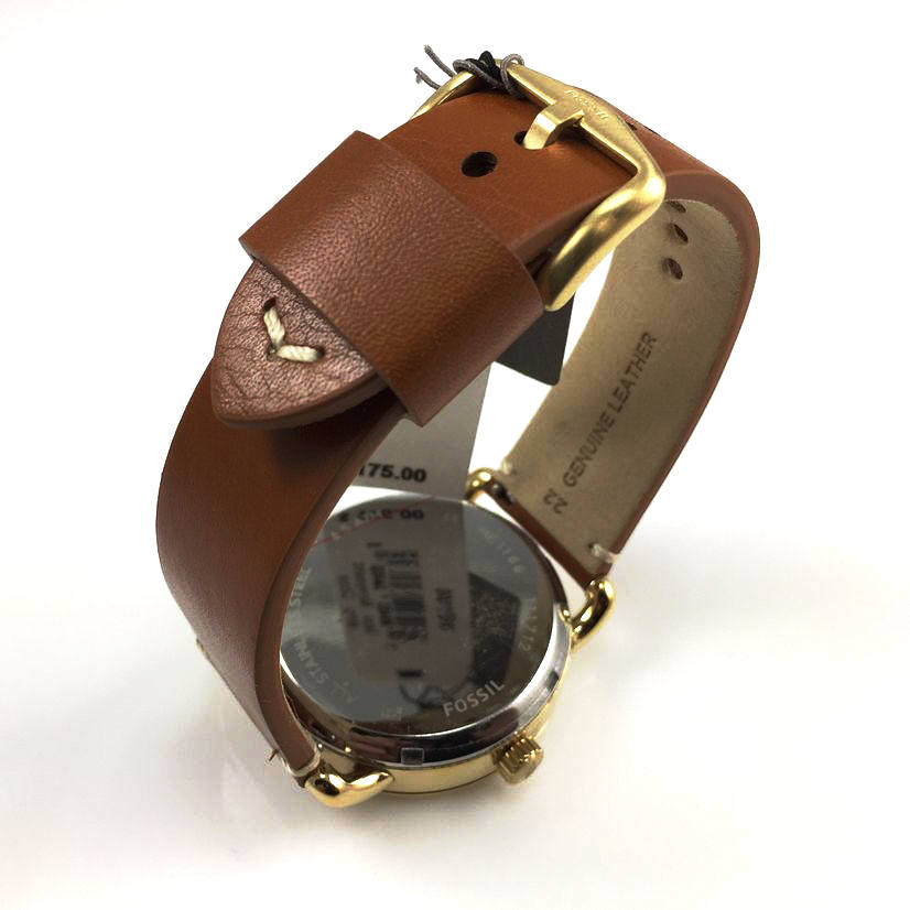 Fossil The Commuter Twist watch worn on wrist with brown leather strap