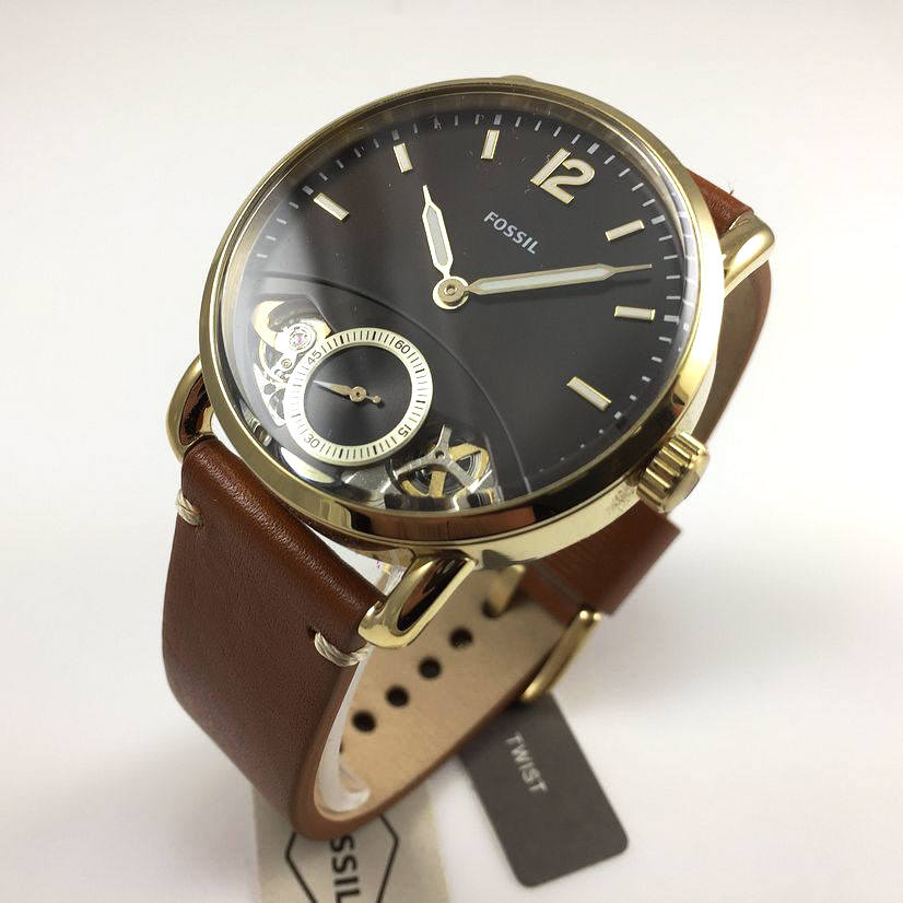 Angled view of Fossil The Commuter Twist watch showing charcoal dial and visible movement