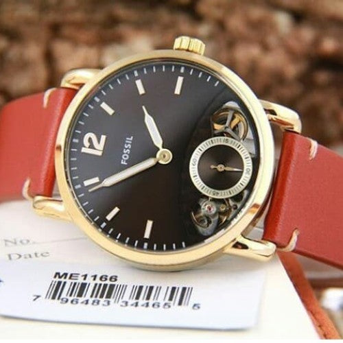 Fossil The Commuter Twist watch displayed with product tag showing model ME1166