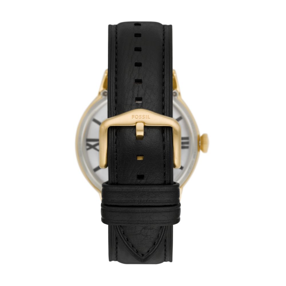 Fossil Townsman watch side view with gold-tone case, black leather strap, and buckle