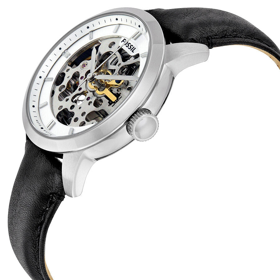 Angled view of Fossil Townsman watch displaying skeleton dial with visible movement and yellow accents