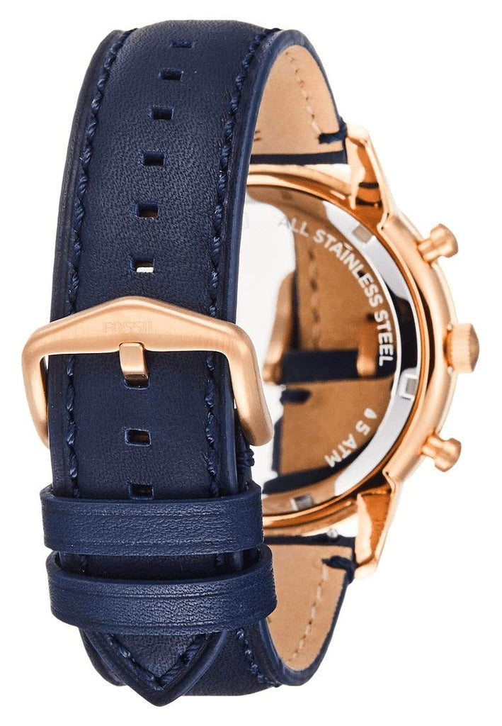 Fossil Townsman FS5436 watch side view showing rose gold-tone case and navy leather strap with stitching