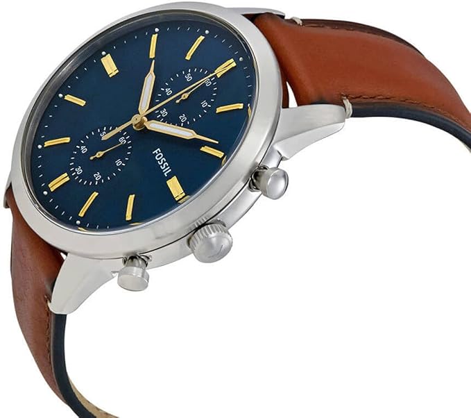 Fossil Townsman chronograph watch positioned at angle displaying blue dial, yellow markers and brown leather strap