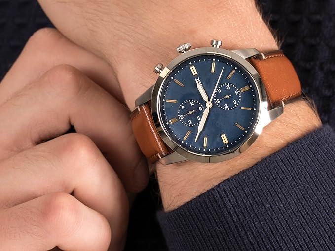 Fossil Townsman watch caseback showing engraved stainless steel back plate and brown leather strap