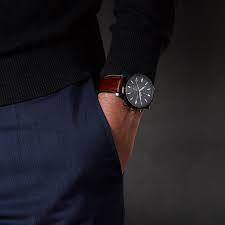 Fossil Townsman FS5522 chronograph watch worn on wrist with gray dial and brown strap
