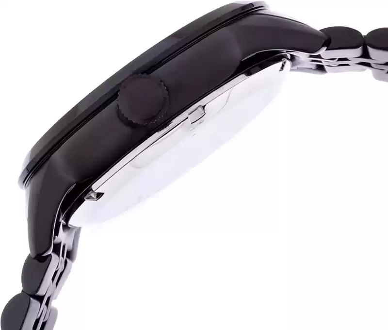 Side profile of Fossil Townsman watch displaying black case thickness and stainless steel bracelet
