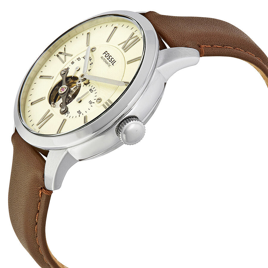 Fossil Townsman watch angle view showing silver case, cream dial, and brown leather band