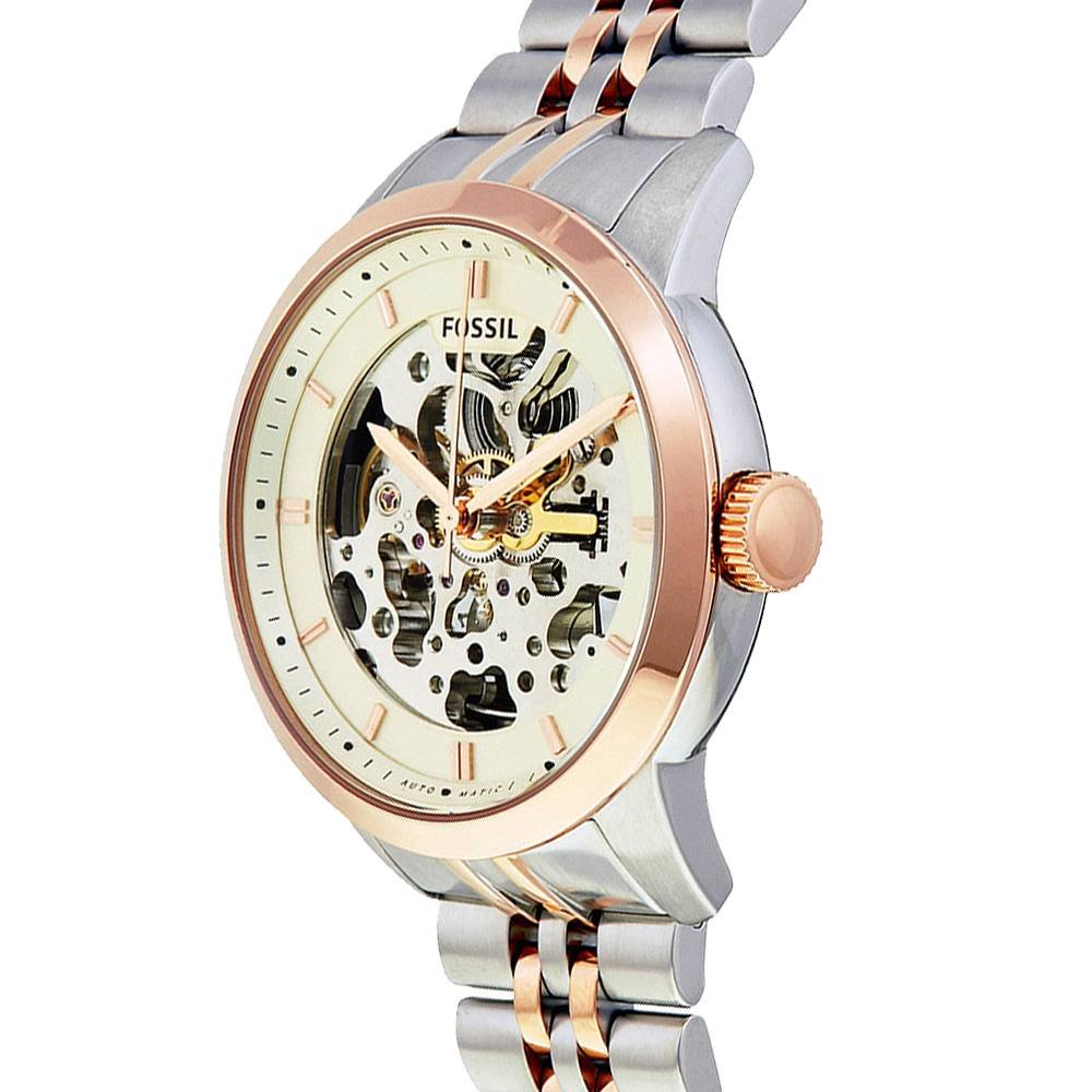 Side angled view of Fossil Townsman automatic watch showing skeleton dial and mixed metal bracelet
