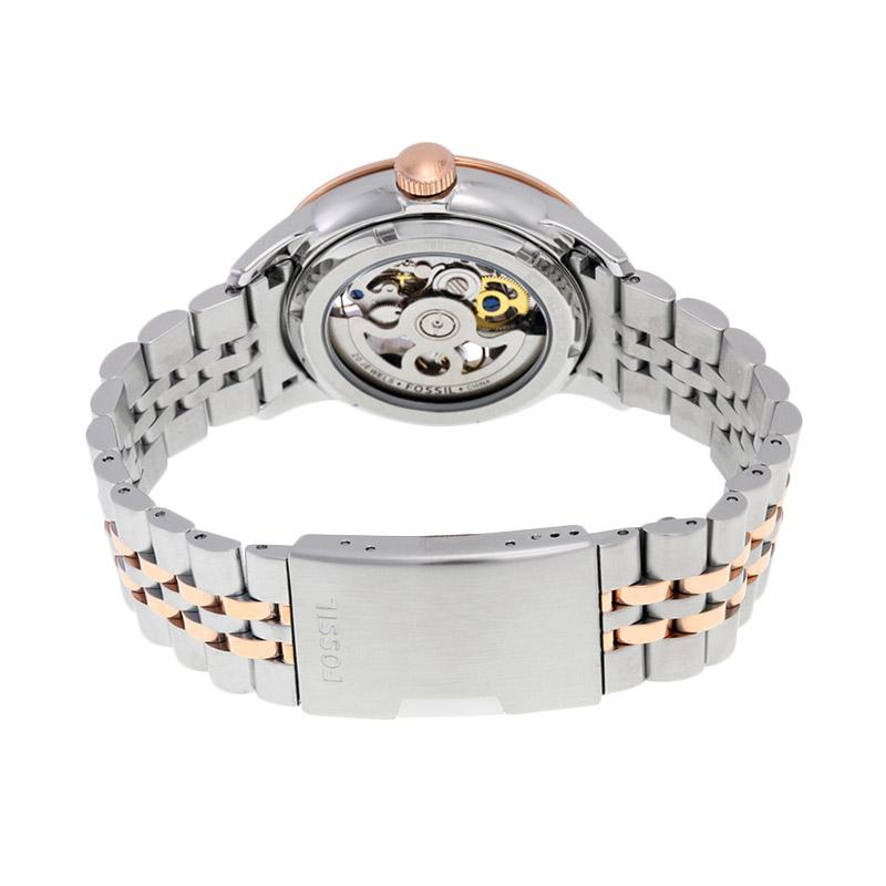 Fossil Townsman automatic caseback showing exposed mechanical movement with visible gears and gold balance wheel